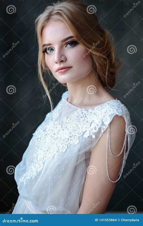 Bride Blonde Woman In A Modern Color Wedding Dress With Elegant Hair