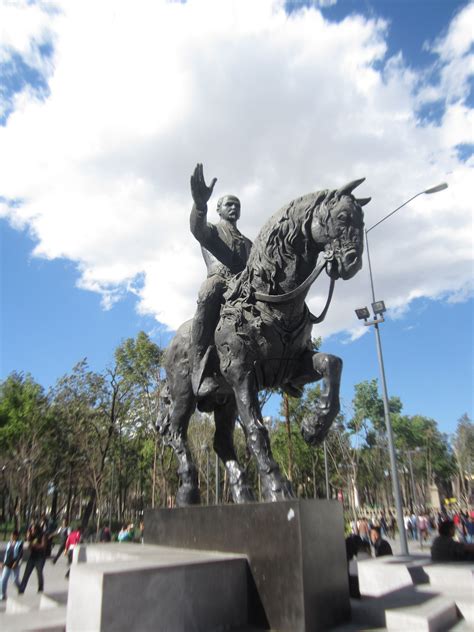 A Statue Of A Man Riding On The Back Of A Horse