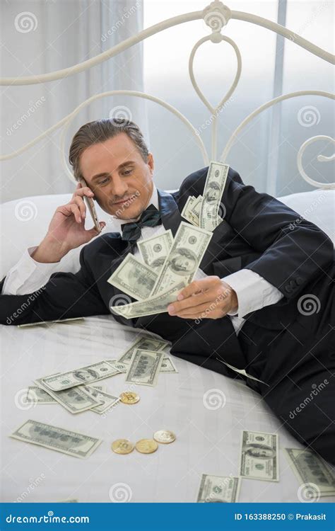 Rich Man Lying On The Bed With Dollar Banknotes Success Business Stock Photo Image Of