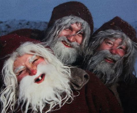 Three Men With Long White Hair And Beards Are Dressed As Santa Clausees