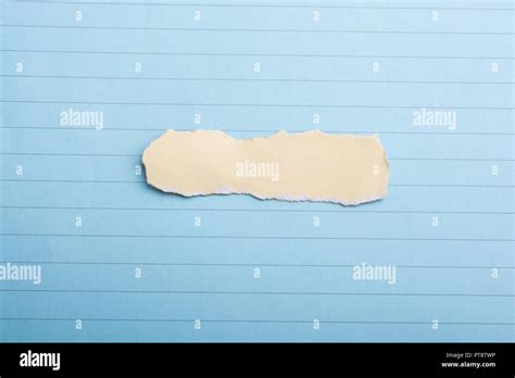 Little Torn Paper Seen On A Sheet Of Paper Stock Photo Alamy