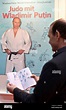 A man leafs through the book 'Judo with Vladimir Putin' at the Stock ...