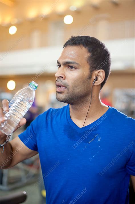 Man Drinking Water Bottle In Gym Stock Image F0054825