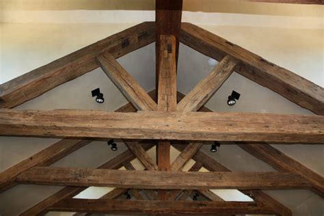 Traditional ceiling beams are actually wooden joists left exposed across the ceiling rather than boxed in or hidden above a ceiling. Hand Hewn Ceiling Beams for Sale | Real Wood Beams