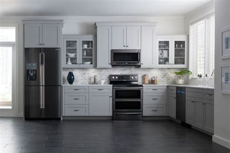 While stainless steel can attract fingerprints, black appliances tend black double wall oven is inserted into the dark wood cabinetry in this kitchen with white subway tile backsplash and white upper cabinets that create. Chic Family-Friendly Appliances : black stainless steel ...