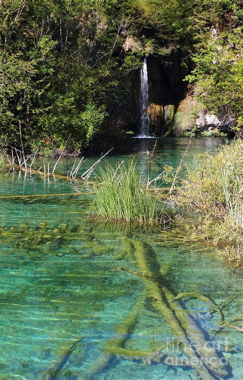 Small Waterfall And An Emerald Colored Lake Photograph By Kiril