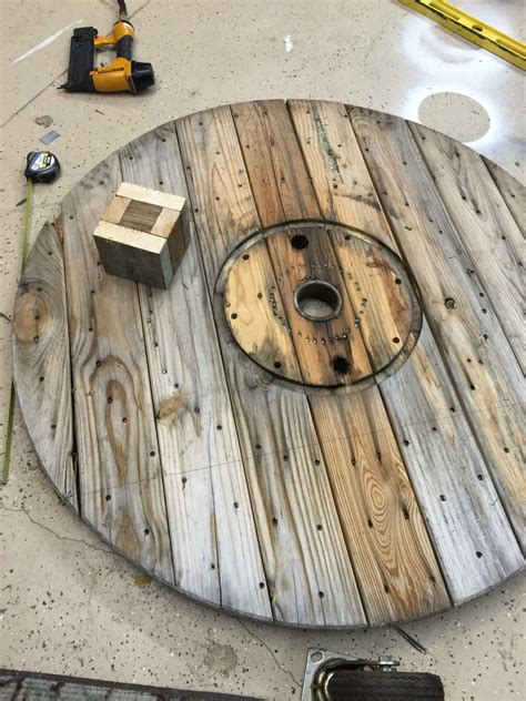 A holiday decorated spool table. DIY Wire Spool Coffee Table - Twelve On Main