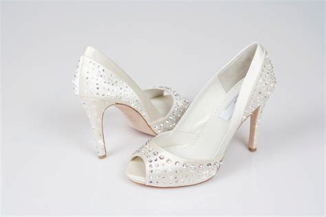 Your wedding is the perfect excuse to treat yourself and, for the shoe addicts among you, there is no better way than with a pair of designer wedding shoes. Bridal Shoes - Wales, UK: Designer Luxury Swarovski Crystal Bridal Shoes Sale