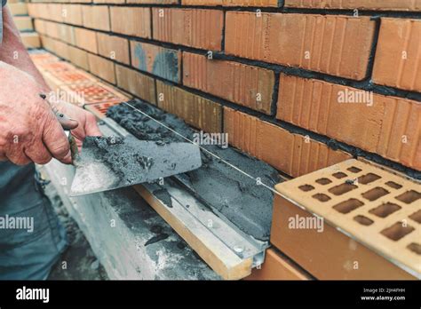 Worker Or Mason Hands Laying Bricks Close Up Bricklayer Works At Brick
