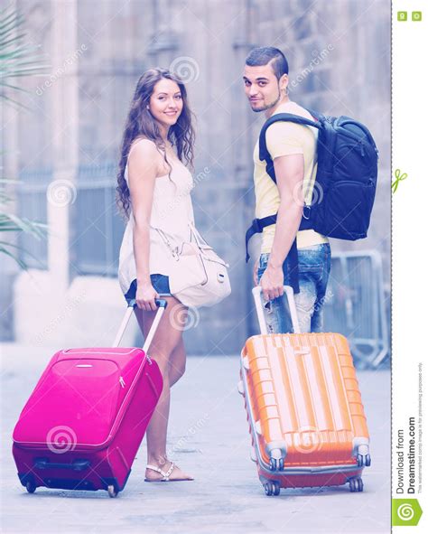 Travelers With Baggage In The Street Stock Photo Image Of Happy