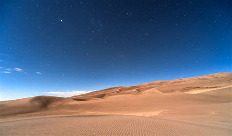 Sky And Stars At Night Above The Desert Landscape In Colorado Image
