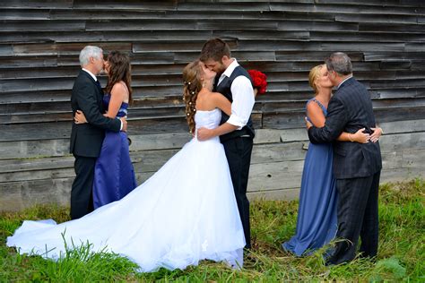 Bride And Groom With Parents All Kissing Wedding Dresses Bride Groom
