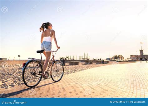 Bicycle Fun On Beach Promenade Happy Woman Riding Bike On Sunny Summer Boulevard Seaside
