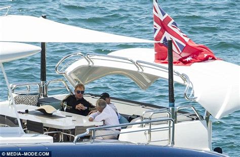 elton john dons his trademark tracksuit on a super yacht in sydney super yachts elton john