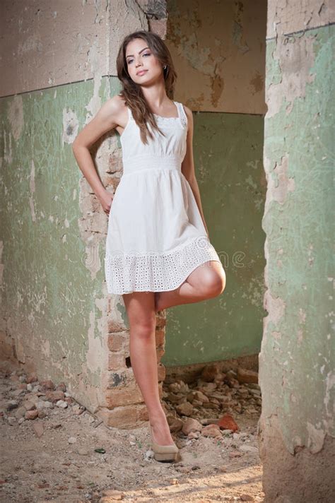 Beautiful Girl Posing Fashion Near An Old Wall Stock Photo