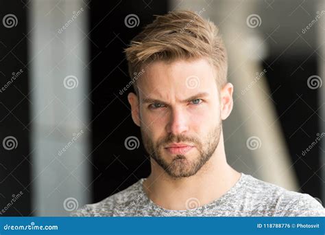 metrosexual concept man bristle serious strict face looks back isolated white man beard