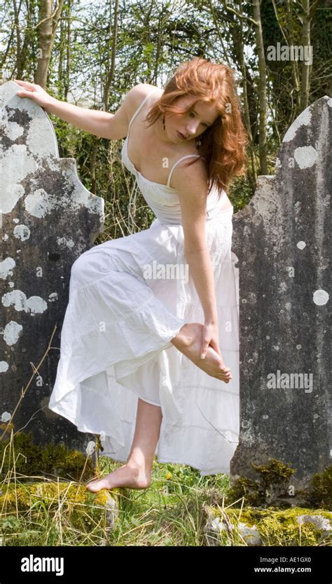 Beautiful Red Hair Irish Woman In Flimsy White Dress With Bare Feet