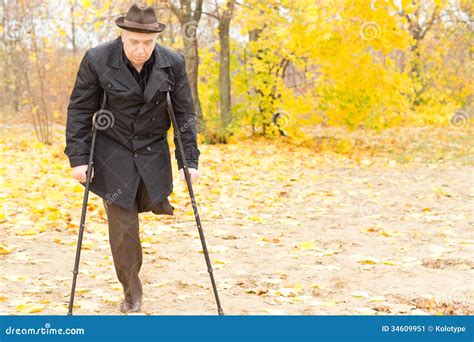 Amputee Walking With Crutches