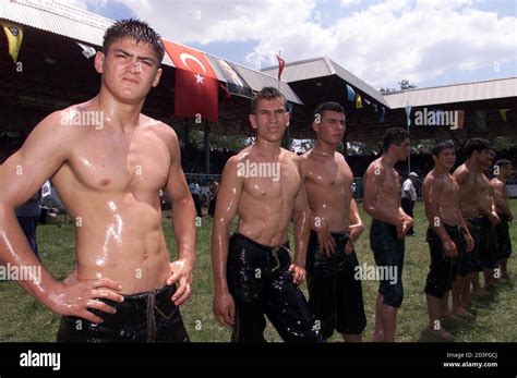 Oil Covered Turkish Wrestlers Line Up At The Start Of Their Traditional