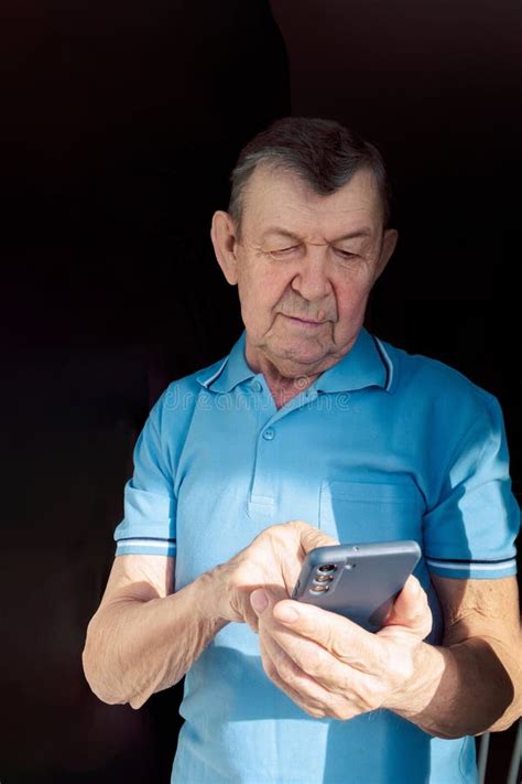 Elderly Man Dials Number In Smartphone From Home Old Senior Sends Sms