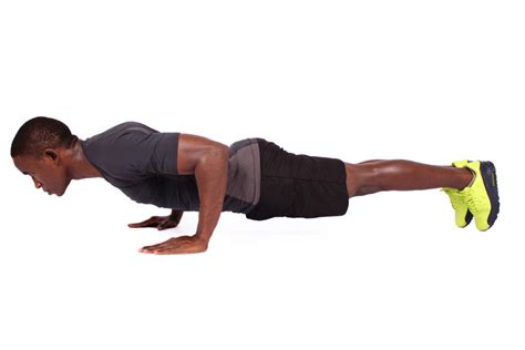 Strong Muscular Man Doing Push Ups On Isolated White Background