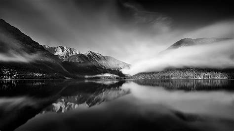 Grayscale Of Snow Covered Mountain Near Body Of Water Hd Wallpaper