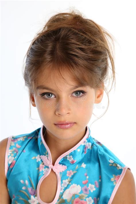 Beautiful Little Girl In An Asian Blue Dress In Fashion Style Stock