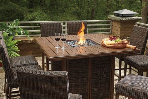 Paradise Trail Outdoor Fire Pit Bar Table Set By Signature Design By