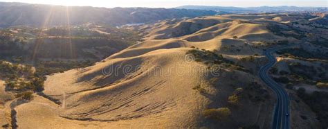 Aerial View Of Beautiful California Hills And Scenic Road Stock Photo