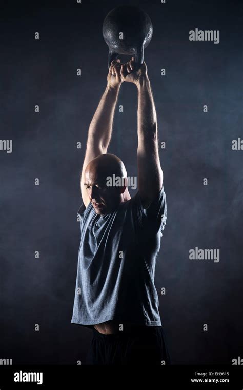 Bald Charismatic Athlete Doing Kettlebell Swings Stock Photo Alamy