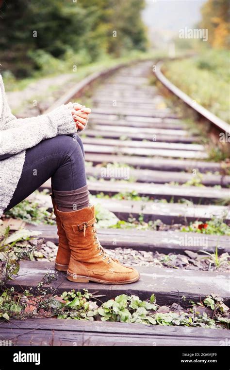 Young Woman Sitting On Rail Track Stock Photo Alamy