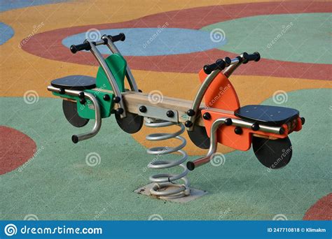 Detail Of Some Of The Swings For Children In A Playground Stock Photo