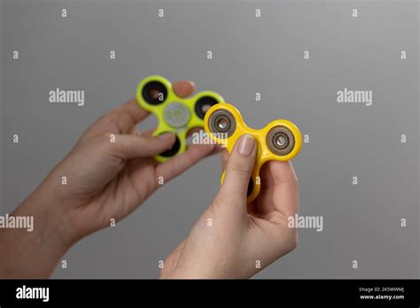 Child Playing With A Spinning Fidget Toy Stock Photo Alamy