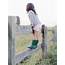 Little Girl Climbing On A Fence By Marta Locklear