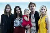 Robert Pattinson holds a baby at the San Sebastian Film Festival