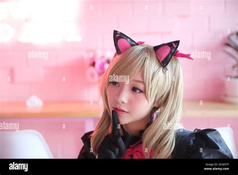 Japan Anime Cosplay Portrait Of Girl Cosplay In Pink Room Background