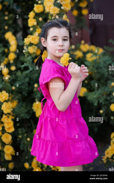 Stylish Little Kid Girl 6 7 Year Old Smelling Yellow Rose Flower Over