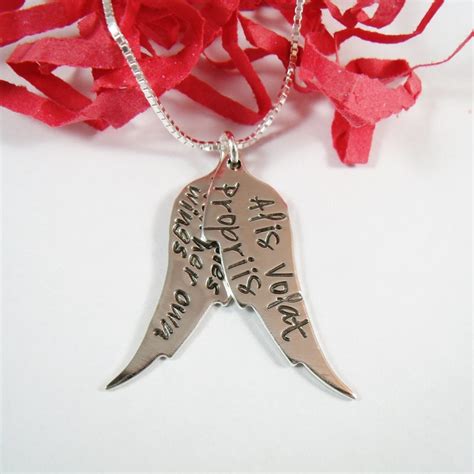The official english version of the motto is she flies with her own wings in keeping with the tradition of considering countries and territories to be feminine. She Flies With Her Own Wings Necklace Alis Volat Propriis