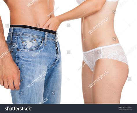 Close Up Of Woman S In Lingerie Inserting Her Hands In Man S Jeans