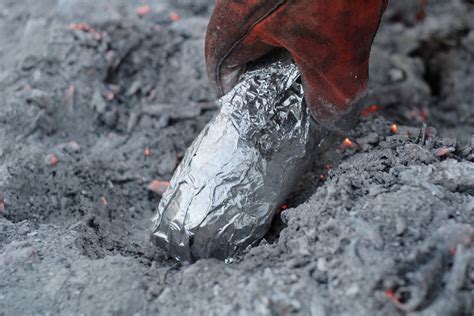 The log will burn from the inside out. How to Cook a Baked Potato on an Open Fire | Livestrong ...