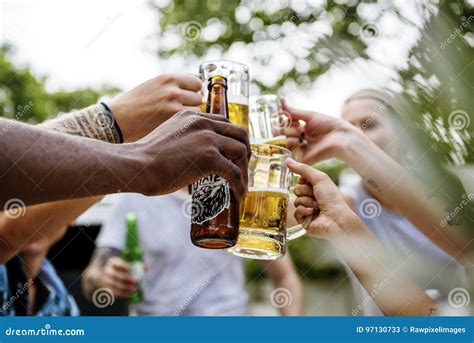 Group Of Diverse Friends Celebrating Drinking Beers Together Stock