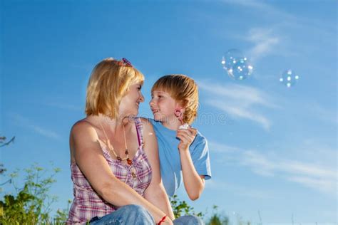 Mother And Son Blowing Bubbles Stock Image Image Of Casual Funny