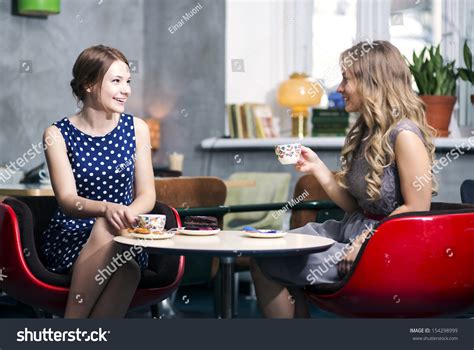 Two Womans Make Dialogue Snile Over Stock Photo 154298999 Shutterstock