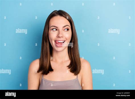 Portrait Of Attractive Curious Cheerful Girl Licking Lip Looking Aside Copy Space Seduction