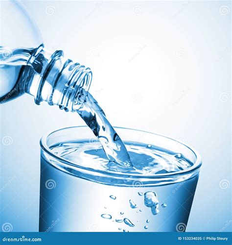 Water Pouring From Bottle Into Glass Cup Stock Image Image Of Health