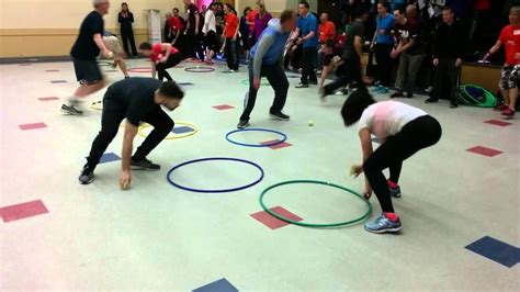 The teacher assigns point values to each color of bean bag: Hula Flip Ball | Physical education games, Gym games for ...