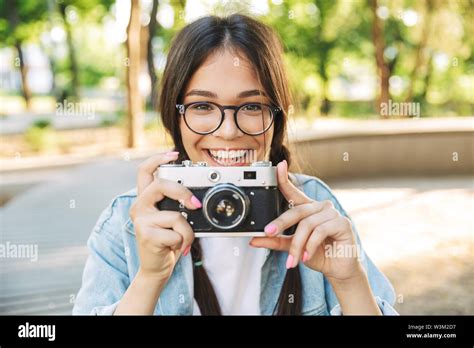 Photo Of A Smiling Optimistic Happy Cute Young Student Girl Wearing