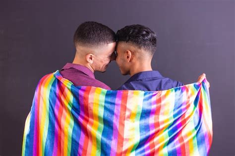 Premium Photo Homosexual Couple On Black Background With Lgbt Flag