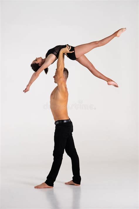 Duo Of Acrobats Showing Hand To Hand Trick Isolated On White Stock Image Image Of Strong