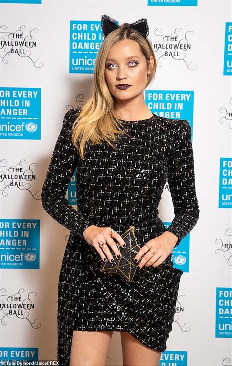 Laura Whitmore Catches The Eye In Spooky Feline Contact Lenses And Cat